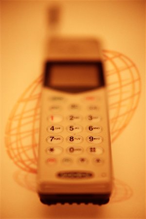 simsearch:700-00025806,k - Close-Up of Cell Phone with Shadow of Wire Globe Stock Photo - Rights-Managed, Code: 700-00031477