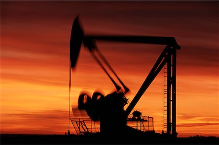 Silhouette of Pump Jack at Sunset Stock Photo - Rights-Managed, Code: 700-00032175