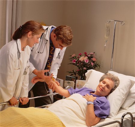 simsearch:846-05647696,k - Doctor and Nurse with Patient Stock Photo - Rights-Managed, Code: 700-00032256