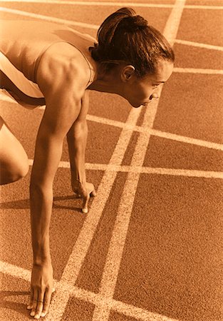 simsearch:700-00157314,k - Female Runner on Starting Blocks Stock Photo - Rights-Managed, Code: 700-00032816