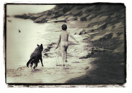 simsearch:700-00035072,k - Back View of Nude Boy Running on Beach With Dog Stock Photo - Rights-Managed, Code: 700-00032958