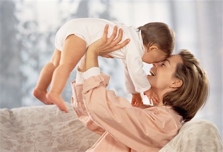 simsearch:700-00080994,k - Mother Lifting Baby Stock Photo - Rights-Managed, Code: 700-00033003