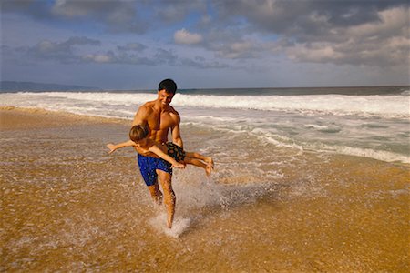 peter griffith - Father and Son in Swimwear Playing on Beach Stock Photo - Rights-Managed, Code: 700-00033469