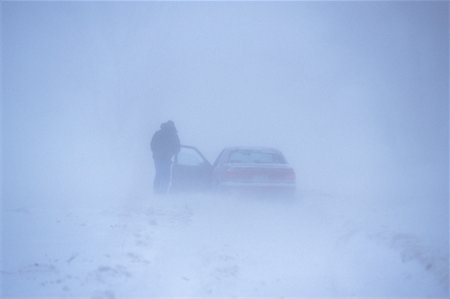 Man Standing Outside of Car in Snowstorm Southern Ontario, Canada Stock Photo - Rights-Managed, Code: 700-00033521