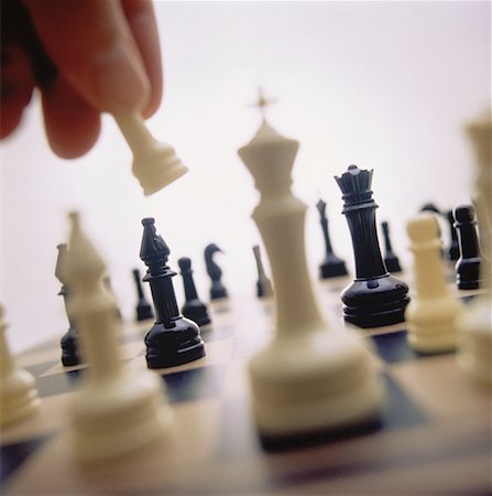 simsearch:700-00075674,k - Close-Up of Hand Lifting Chess Piece Stock Photo - Rights-Managed, Code: 700-00044083