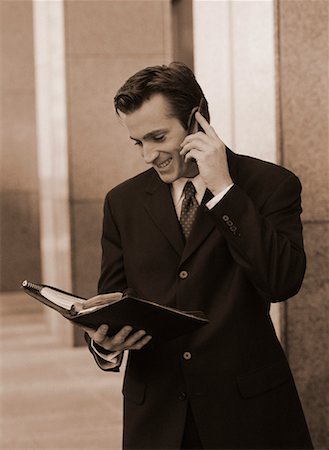 simsearch:700-00163379,k - Businessman Using Cell Phone and Day Timer Outdoors Stock Photo - Rights-Managed, Code: 700-00044576