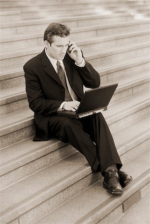 simsearch:700-00163379,k - Businessman Sitting on Steps Using Cell Phone and Laptop Computer Outdoors Stock Photo - Rights-Managed, Code: 700-00044583