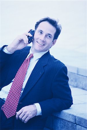 simsearch:700-00163379,k - Businessman Sitting on Steps Using Cell Phone Outdoors Stock Photo - Rights-Managed, Code: 700-00044660