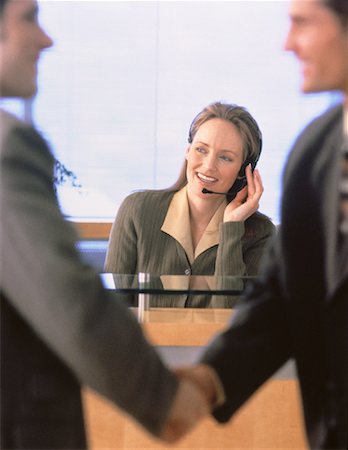 Businessmen Shaking Hands near Receptionist Stock Photo - Rights-Managed, Code: 700-00044684