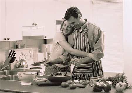 Couple Preparing Food in Kitchen Foto de stock - Con derechos protegidos, Código: 700-00045167