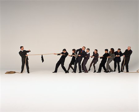 disadvantage - Businessman Having Tug-of-War With Group of Business People Stock Photo - Rights-Managed, Code: 700-00045161