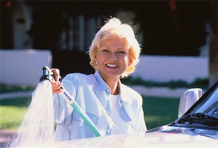 simsearch:700-00593102,k - Portrait of Mature Woman Washing Car Stock Photo - Rights-Managed, Code: 700-00045599