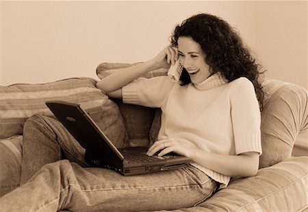 simsearch:700-00083403,k - Woman on Sofa Using Cordless Phone and Laptop Computer Stock Photo - Rights-Managed, Code: 700-00046008