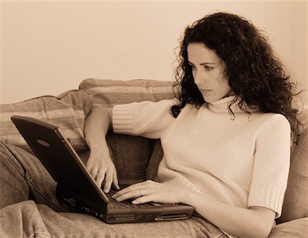 simsearch:700-00083403,k - Woman on Sofa Using Laptop Computer Stock Photo - Rights-Managed, Code: 700-00046009