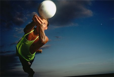 diving (not water) - Man Hitting Volleyball at Dusk Stock Photo - Rights-Managed, Code: 700-00046163