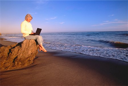 simsearch:700-00083403,k - Mature Woman Using Laptop Computer on Beach Stock Photo - Rights-Managed, Code: 700-00046872