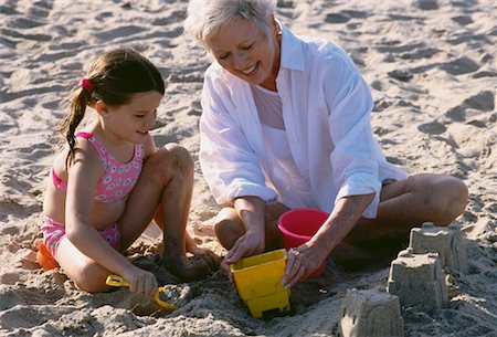 simsearch:700-00046927,k - Grandmother and Granddaughter Building Sand Castles on Beach Stock Photo - Rights-Managed, Code: 700-00046922