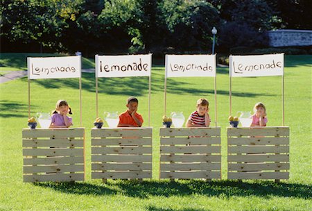 Children with Competing Lemonade Stands, Waiting for Customers Stock Photo - Rights-Managed, Code: 700-00047152
