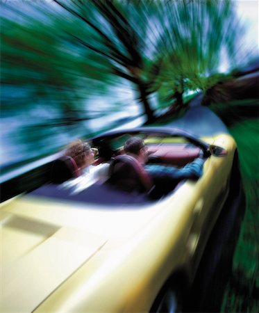 simsearch:700-00089787,k - Blurred View of Couple Driving in Convertible Stock Photo - Rights-Managed, Code: 700-00047406