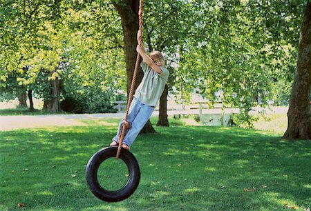 Boy on Tire Swing Stock Photo - Rights-Managed, Code: 700-00048125