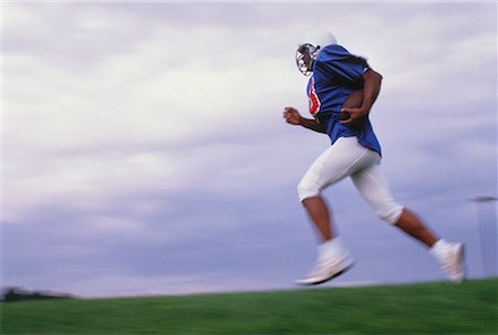 simsearch:700-00048630,k - Football Player Running with Football Stock Photo - Rights-Managed, Code: 700-00048319