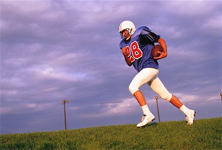 simsearch:700-00048630,k - Football Player Running with Football Stock Photo - Rights-Managed, Code: 700-00048321