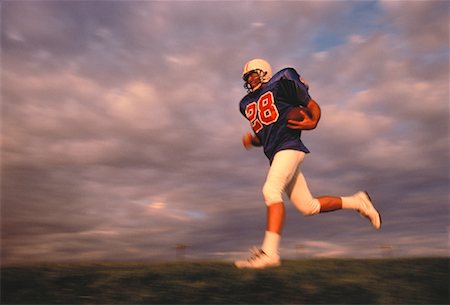 simsearch:700-00048630,k - Football Player Running with Ball Stock Photo - Rights-Managed, Code: 700-00048634