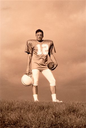 simsearch:700-00048630,k - Portrait of Football Player Holding Ball and Helmet Outdoors Stock Photo - Rights-Managed, Code: 700-00048639