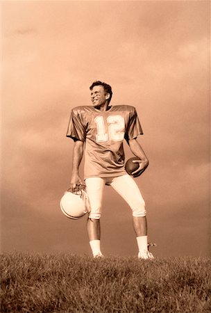 simsearch:700-00048630,k - Portrait of Football Player Holding Ball and Helmet Outdoors Stock Photo - Rights-Managed, Code: 700-00048640