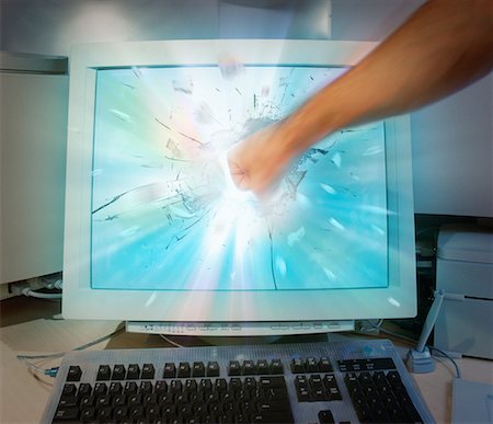 Fist Smashing Computer Screen Stock Photo - Rights-Managed, Code: 700-00049125