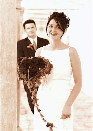 simsearch:700-00085631,k - Portrait of Bride Holding Bouquet With Groom in Background Stock Photo - Rights-Managed, Code: 700-00049133