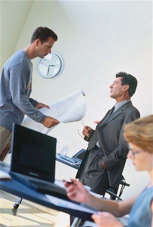 Business People Discussing Blueprints in Office Stock Photo - Rights-Managed, Code: 700-00049775