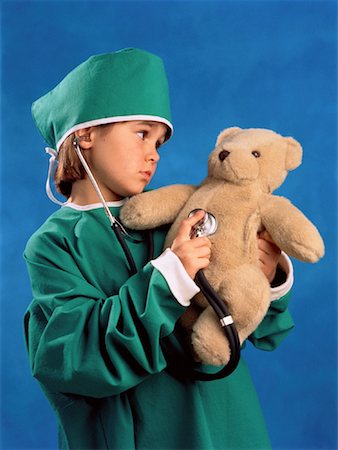 Child Dressed as Doctor with Teddy Bear Stock Photo - Rights-Managed, Code: 700-00040422