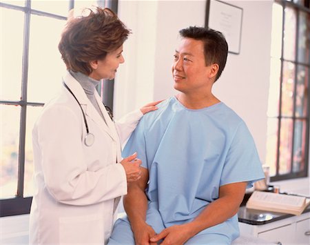 simsearch:700-00616589,k - Female Doctor and Male Patient Talking Stock Photo - Rights-Managed, Code: 700-00040671