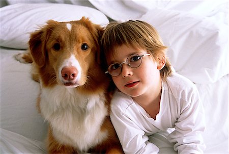 simsearch:700-00071488,k - Portrait of Boy and Dog on Bed Stock Photo - Rights-Managed, Code: 700-00041381