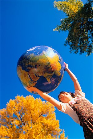 Girl with Inflatable Globe Outdoors in Autumn Stock Photo - Rights-Managed, Code: 700-00041806