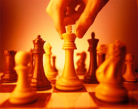 simsearch:700-00075674,k - Hand Moving Chess Pieces Stock Photo - Rights-Managed, Code: 700-00042429