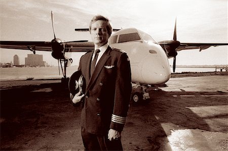 Portrait of Pilot near Plane Stock Photo - Rights-Managed, Code: 700-00042668