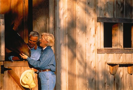 Mature Couple with Horse at Stable Stock Photo - Rights-Managed, Code: 700-00042855