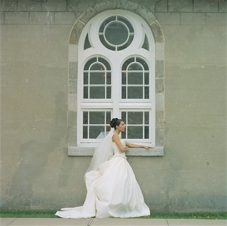 simsearch:700-00078450,k - Bride Standing in Front of Window Outdoors Stock Photo - Rights-Managed, Code: 700-00054258