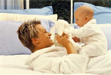 simsearch:700-00080994,k - Mother and Baby on Bed, Playing With Plush Toy Stock Photo - Rights-Managed, Code: 700-00054378