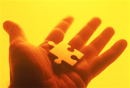 simsearch:700-00284729,k - Close-Up of Jigsaw Puzzle Piece In Palm of Hand Stock Photo - Rights-Managed, Code: 700-00055121