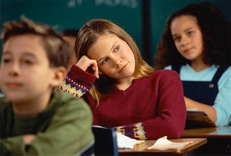 simsearch:700-00087935,k - Girl Sitting at Desk in Classroom Resting Head on Hand Stock Photo - Rights-Managed, Code: 700-00055404