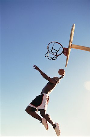 simsearch:700-00060777,k - Man Jumping in Air with Basketball Outdoors Stock Photo - Rights-Managed, Code: 700-00055508