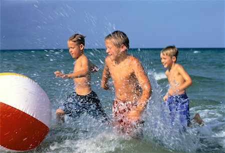 simsearch:700-00020587,k - Three Boys in Swimwear, Playing With Beach Ball in Water on Beach Stock Photo - Rights-Managed, Code: 700-00055534
