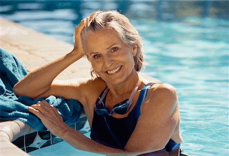 simsearch:700-00057270,k - Portrait of Mature Woman Leaning On Edge of Swimming Pool Stock Photo - Rights-Managed, Code: 700-00055986