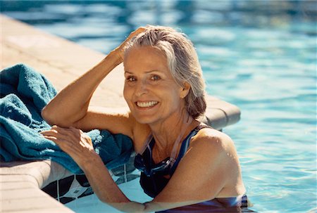 simsearch:700-00057270,k - Portrait of Mature Woman Leaning On Edge of Swimming Pool Stock Photo - Rights-Managed, Code: 700-00055987