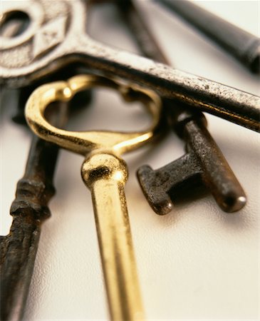 simsearch:700-00023730,k - Close-Up of Gold Skeleton Key With Tarnished Skeleton Keys Stock Photo - Rights-Managed, Code: 700-00058086