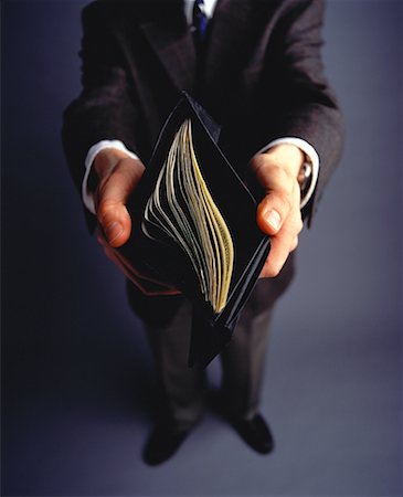Businessman's Hands Holding Open Wallet Full of Cash Stock Photo - Rights-Managed, Code: 700-00058310