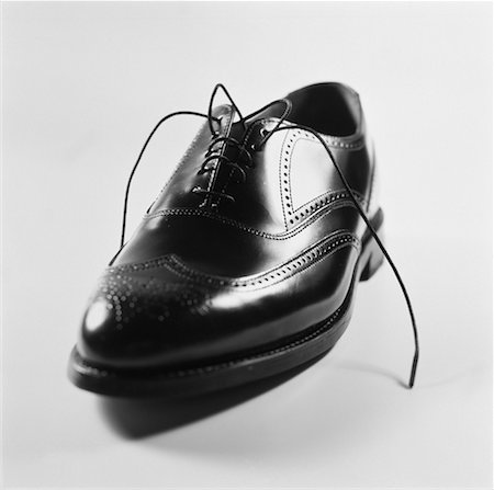simsearch:700-00157050,k - Man's Untied Dress Shoe Stock Photo - Rights-Managed, Code: 700-00058434